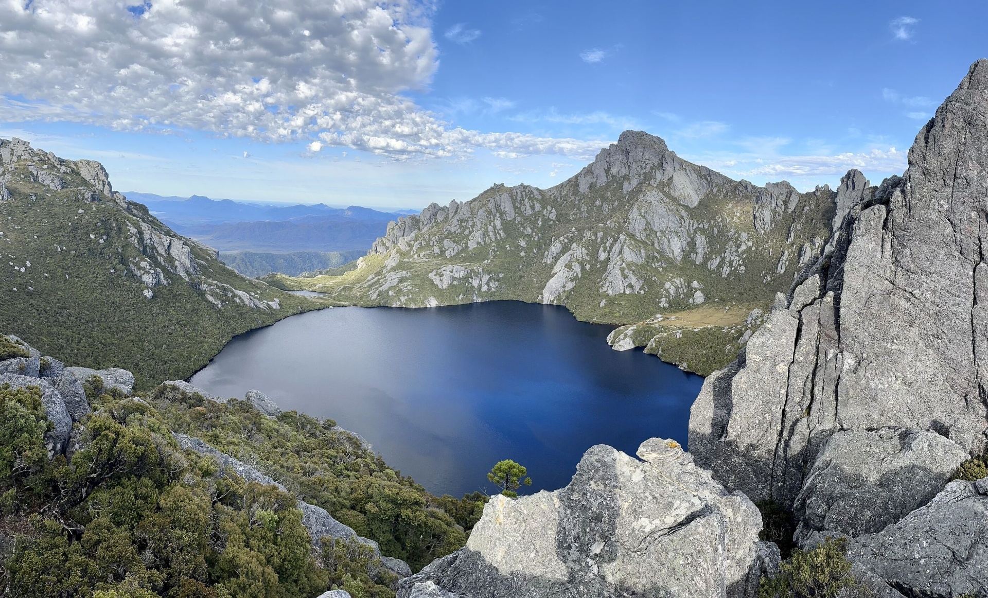 Deep alpine tarn beneath a Tasmanian dolerite peak